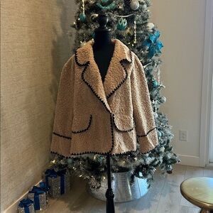 Cozy Tan Sherpa Jacket with Black Trim